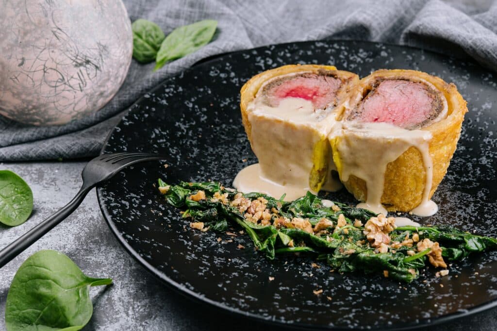 Pork tenderloin en croute on black plate