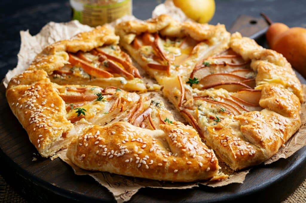Galette with pear and blue cheese dipped in honey. Healthy eating.